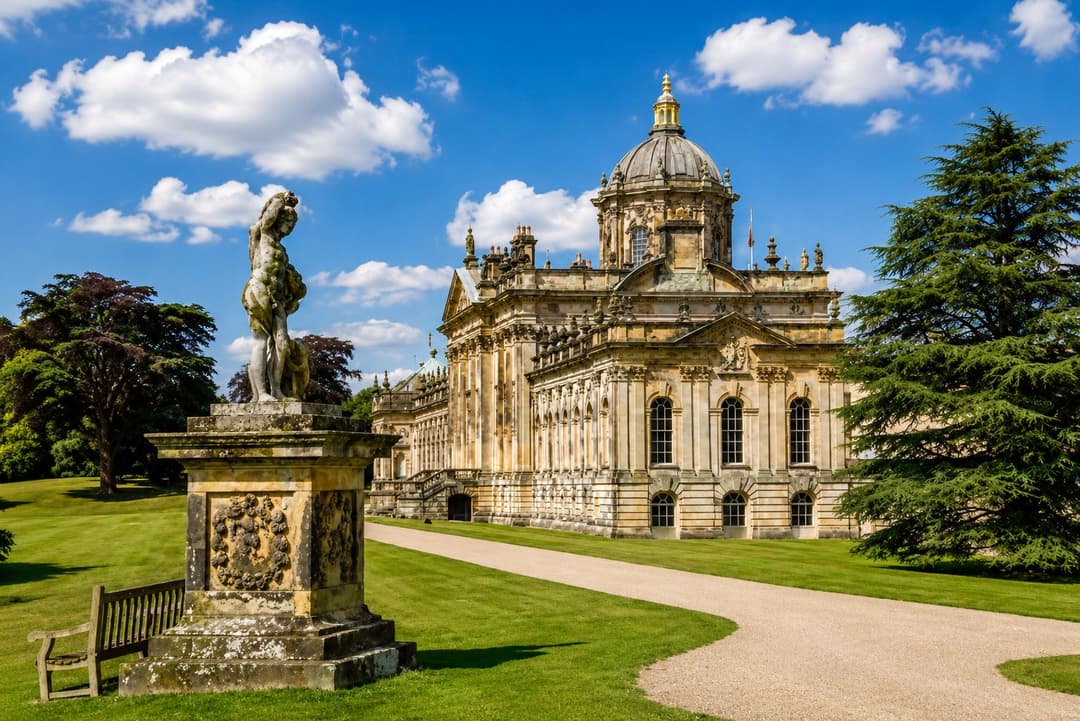 The domed baroque facade of Castle Howard reflected in its lake
