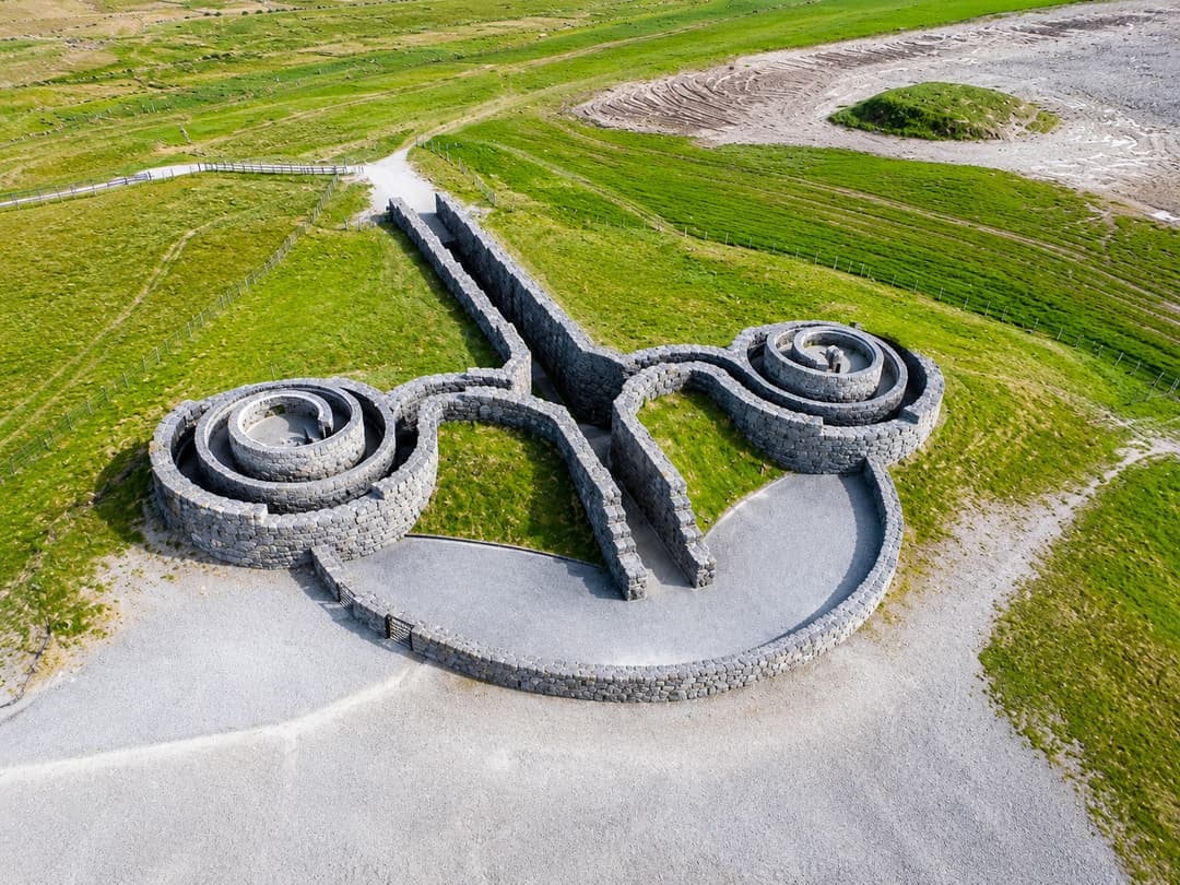 The sweeping dry stone curves and spiral of the Coldstones Cut land art on Greenhow Hill