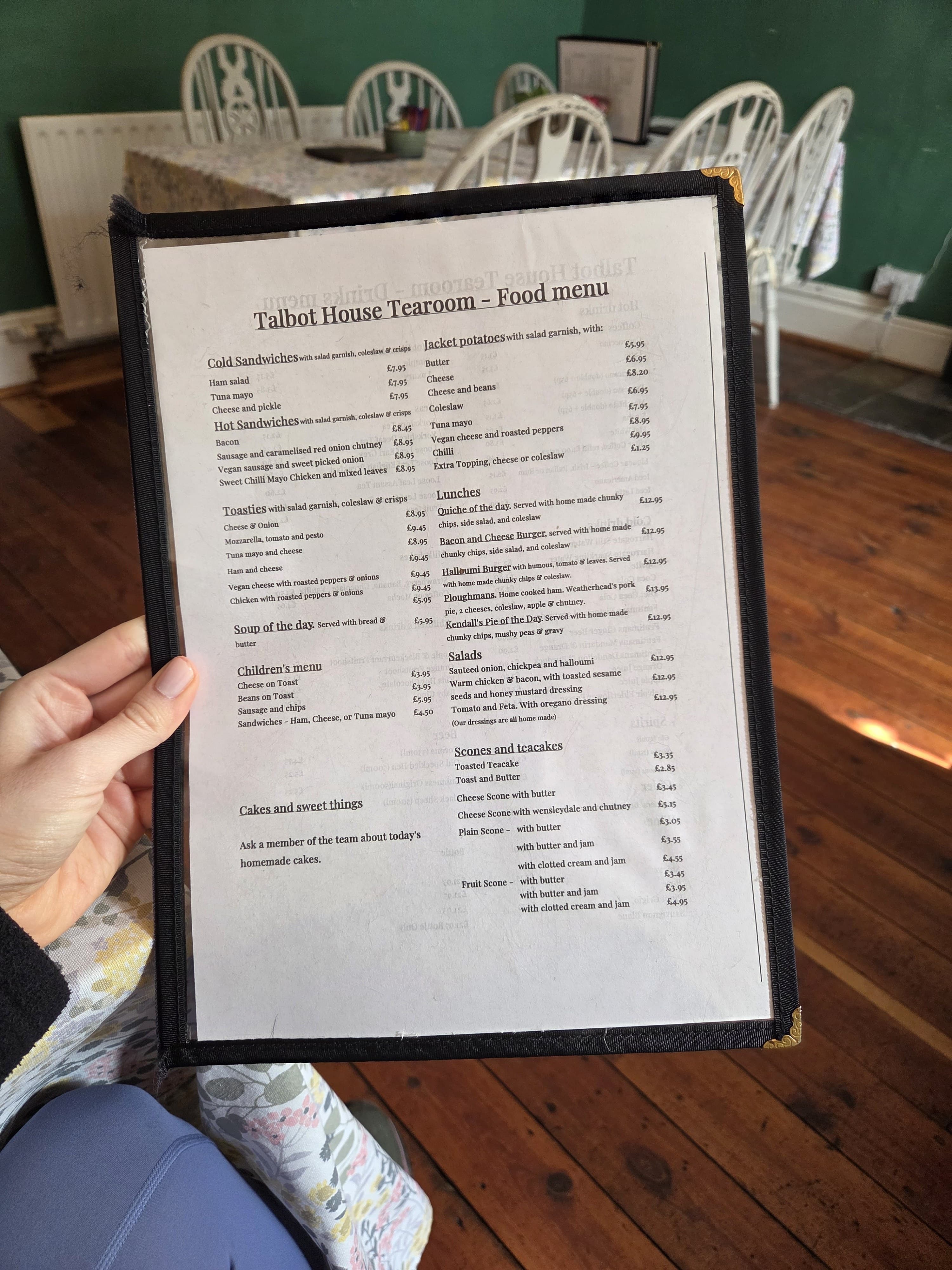 The Talbot House Tearoom food menu, listing sandwiches, toasties, jacket potatoes, lunches, salads, scones and teacakes