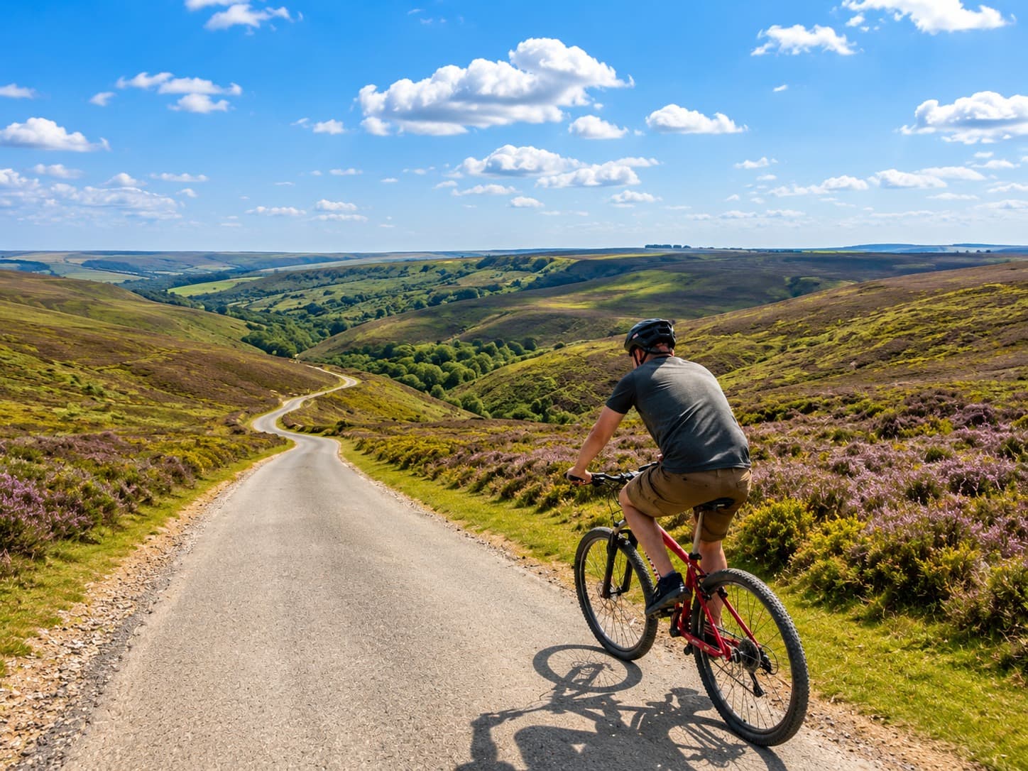 A family cycling along a quiet valley-floor lane near Pateley Bridge